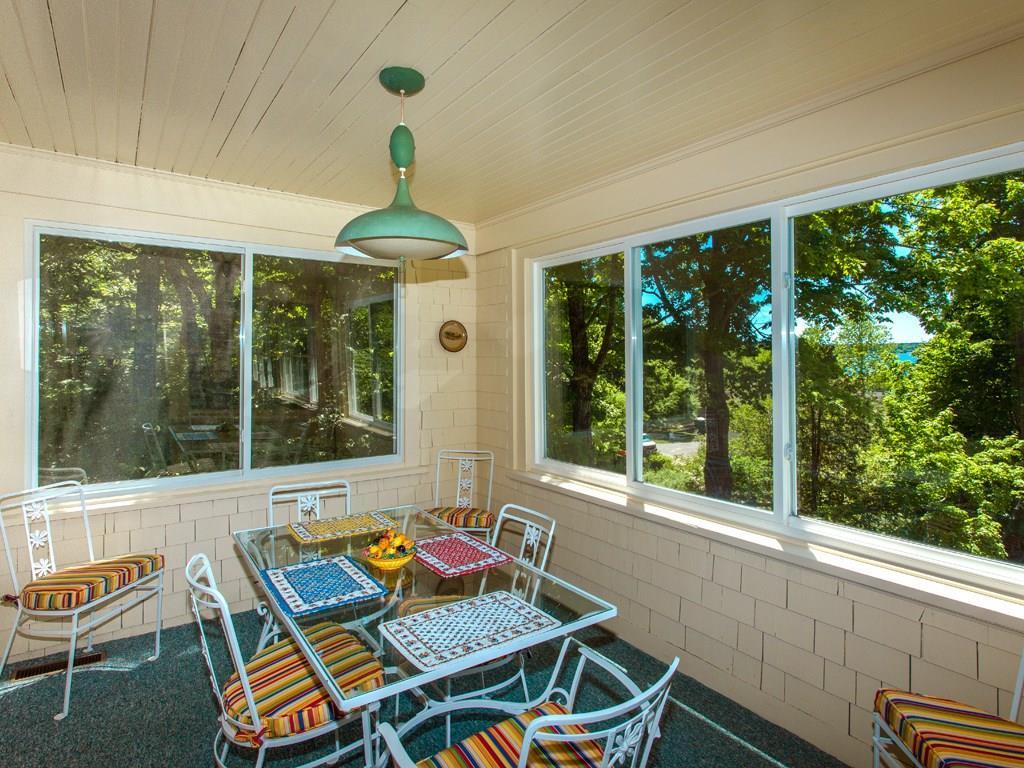 26 Manchester Road Northeast Harbor, ME 04662 - Photo 14 of 35 Sunporch with eating area and water...