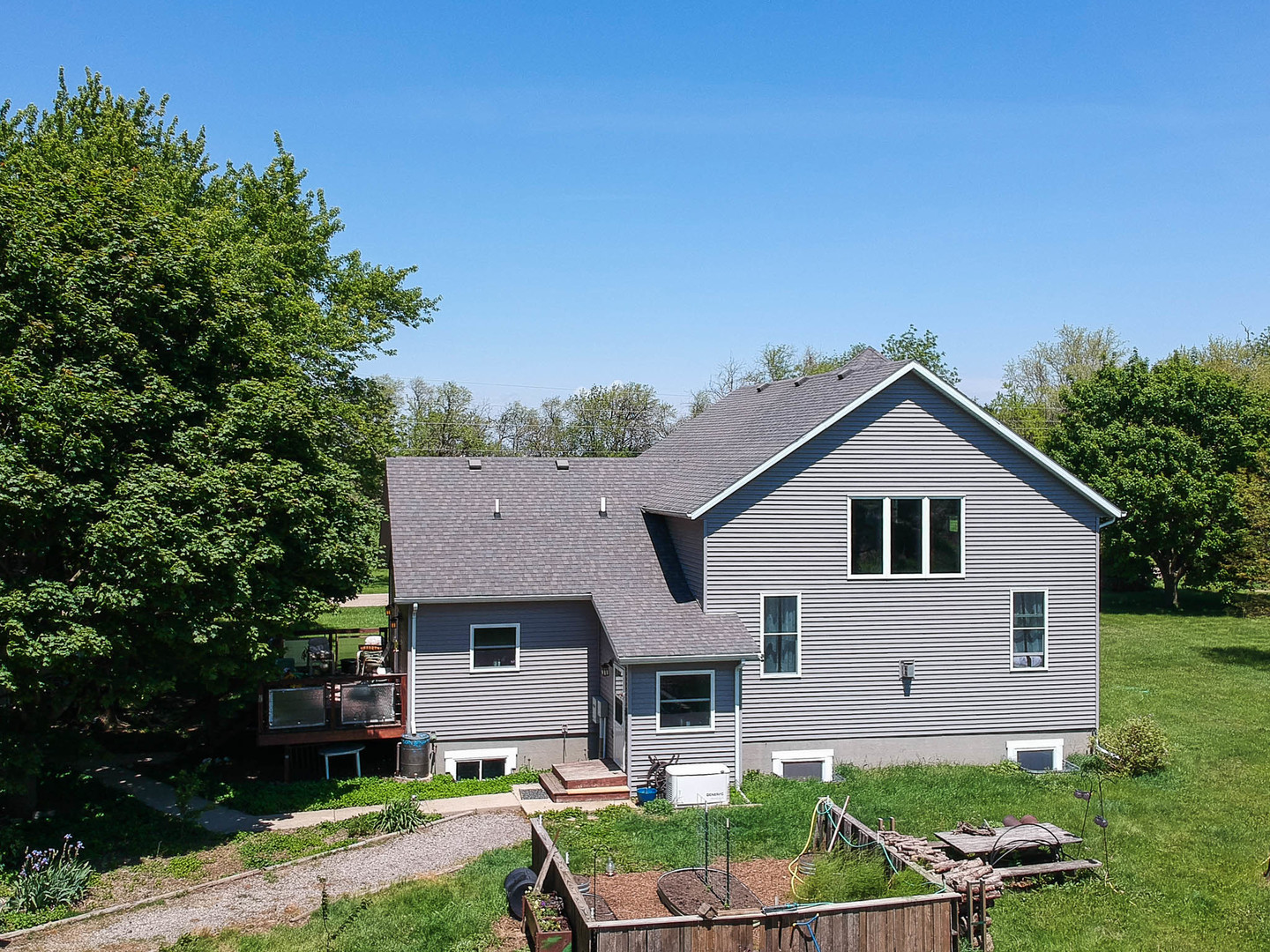 12014 Prairie Center Road Clinton, IL 61727 - Photo 35 of 56 a front view of a house with a yard