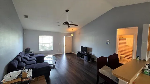 a living room with furniture and a flat screen tv