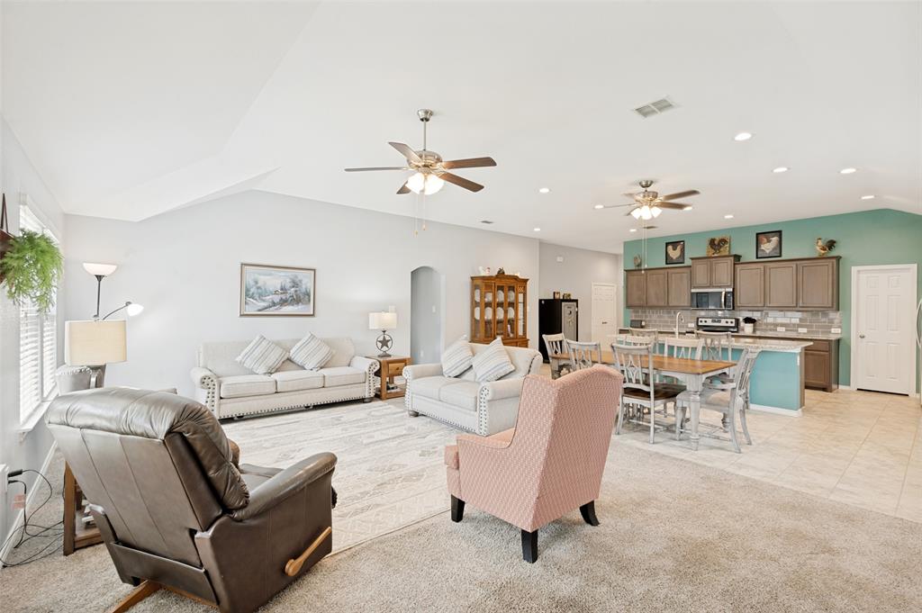 3905 Bridle Path Lane Sanger, TX 76266 - Photo 13 of 26 a living room with furniture kitchen view and a chandelier