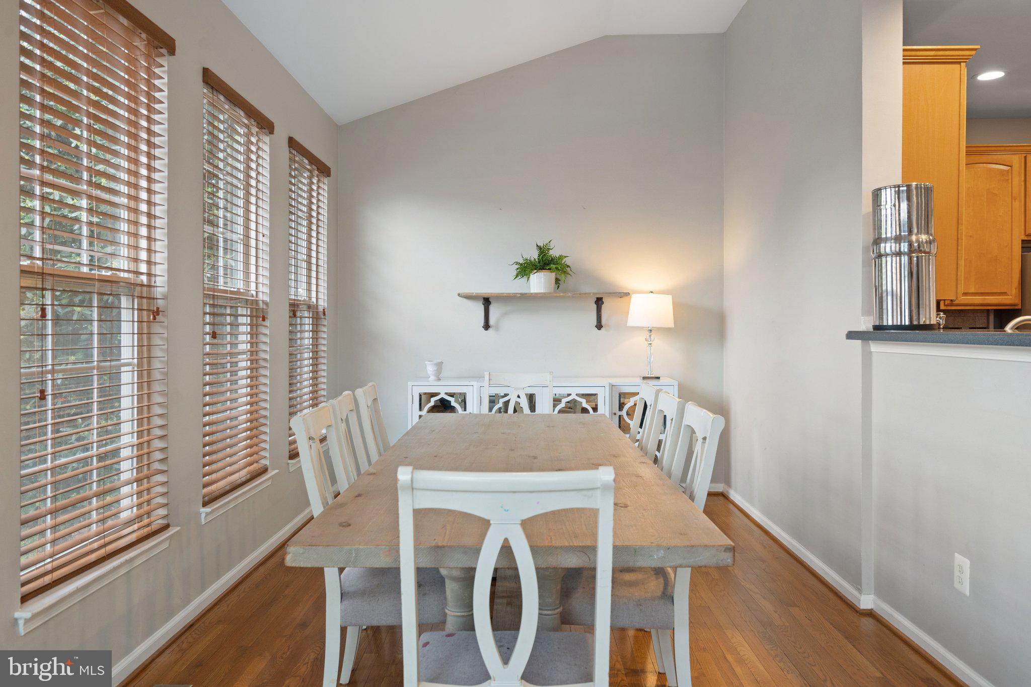6754 Stapleton Place Gainesville, VA 20155 - Photo 13 of 39 a view of a dining room with furniture window and wooden floor