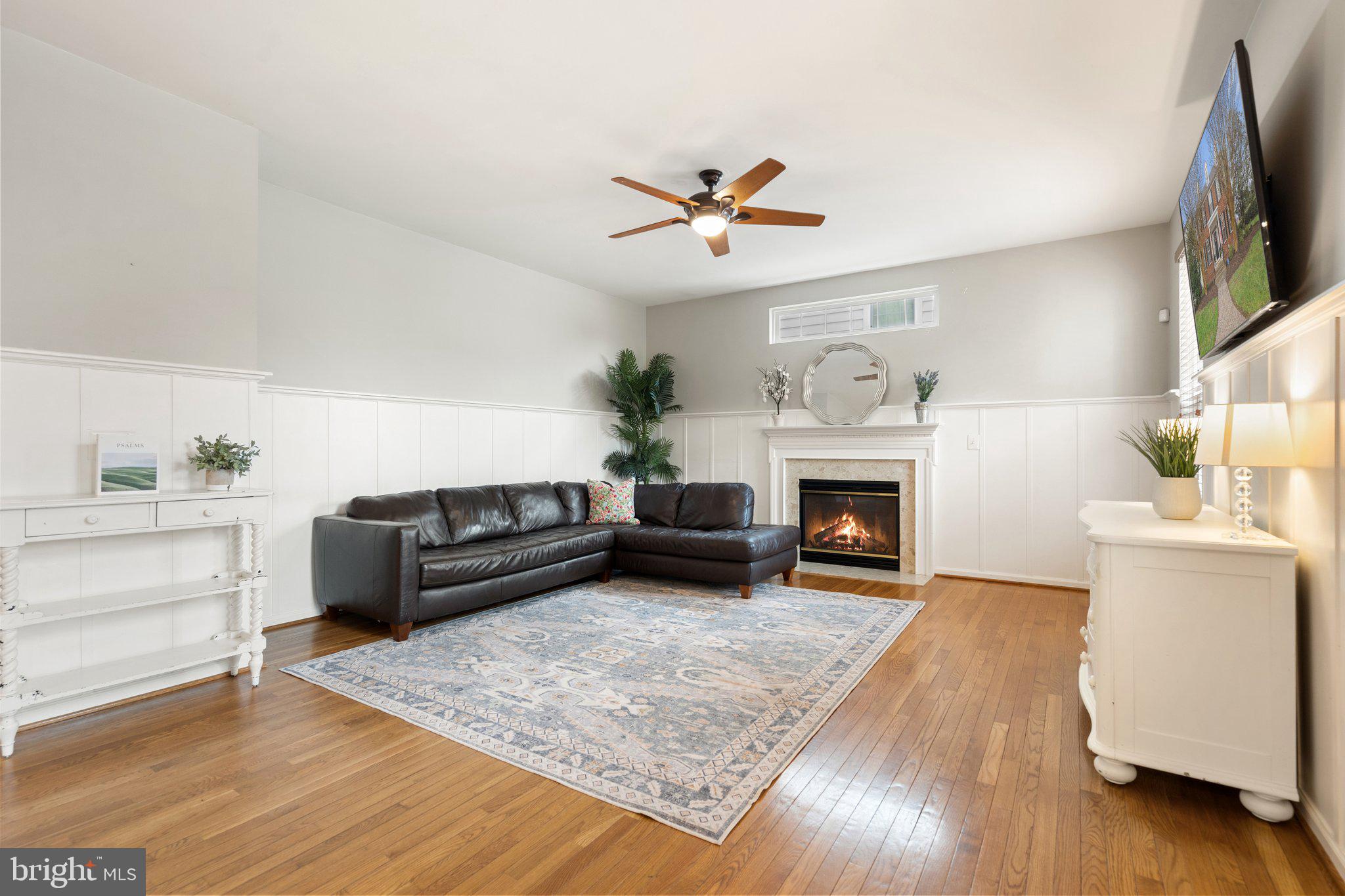 6754 Stapleton Place Gainesville, VA 20155 - Photo 16 of 39 a living room with furniture and a fireplace