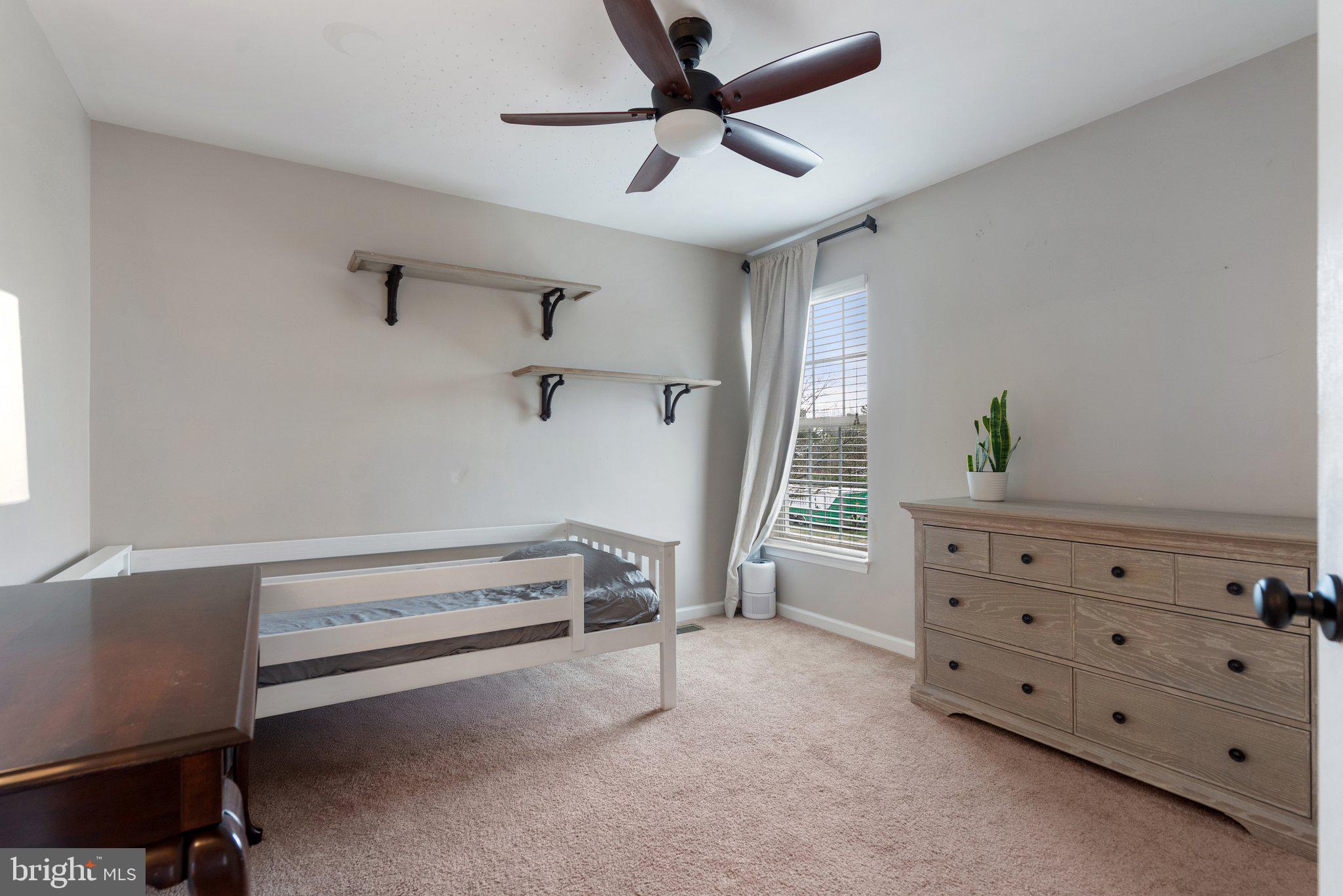 6754 Stapleton Place Gainesville, VA 20155 - Photo 27 of 39 a view of room with window and a ceiling fan