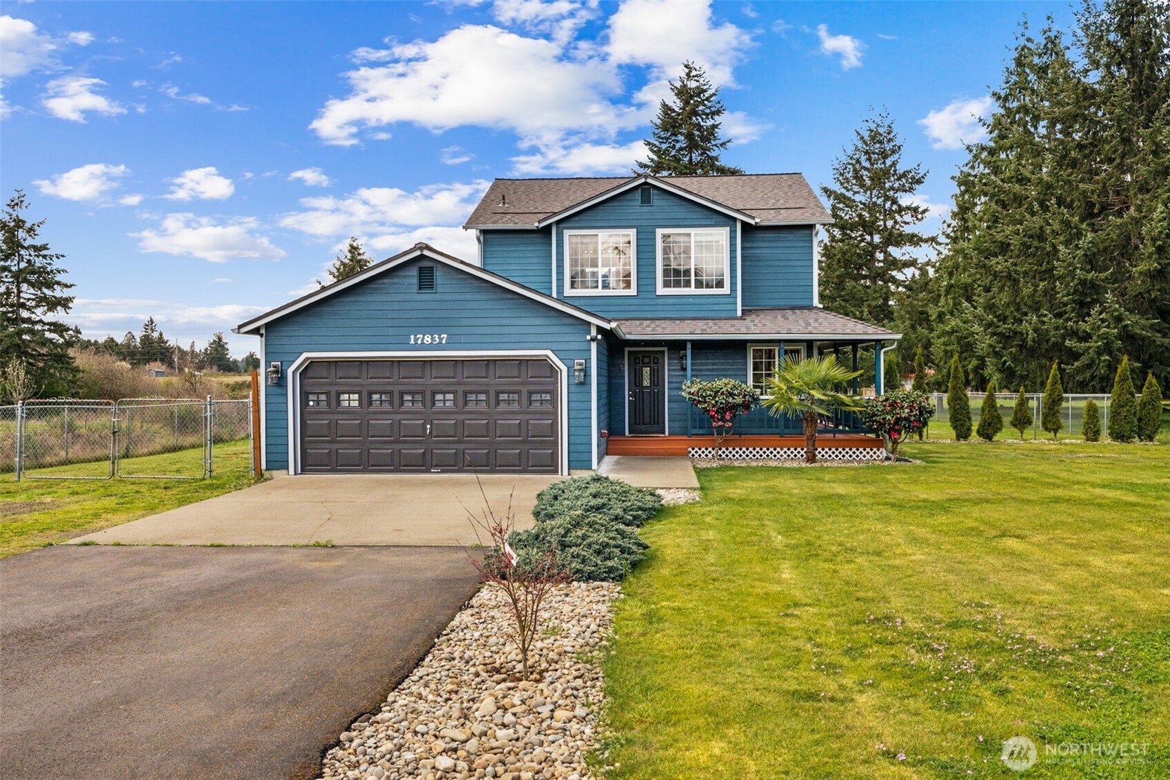 17837 Gilbert Street Southeast Tenino, WA 98589 - Photo 1 of 32 a front view of a house with garden