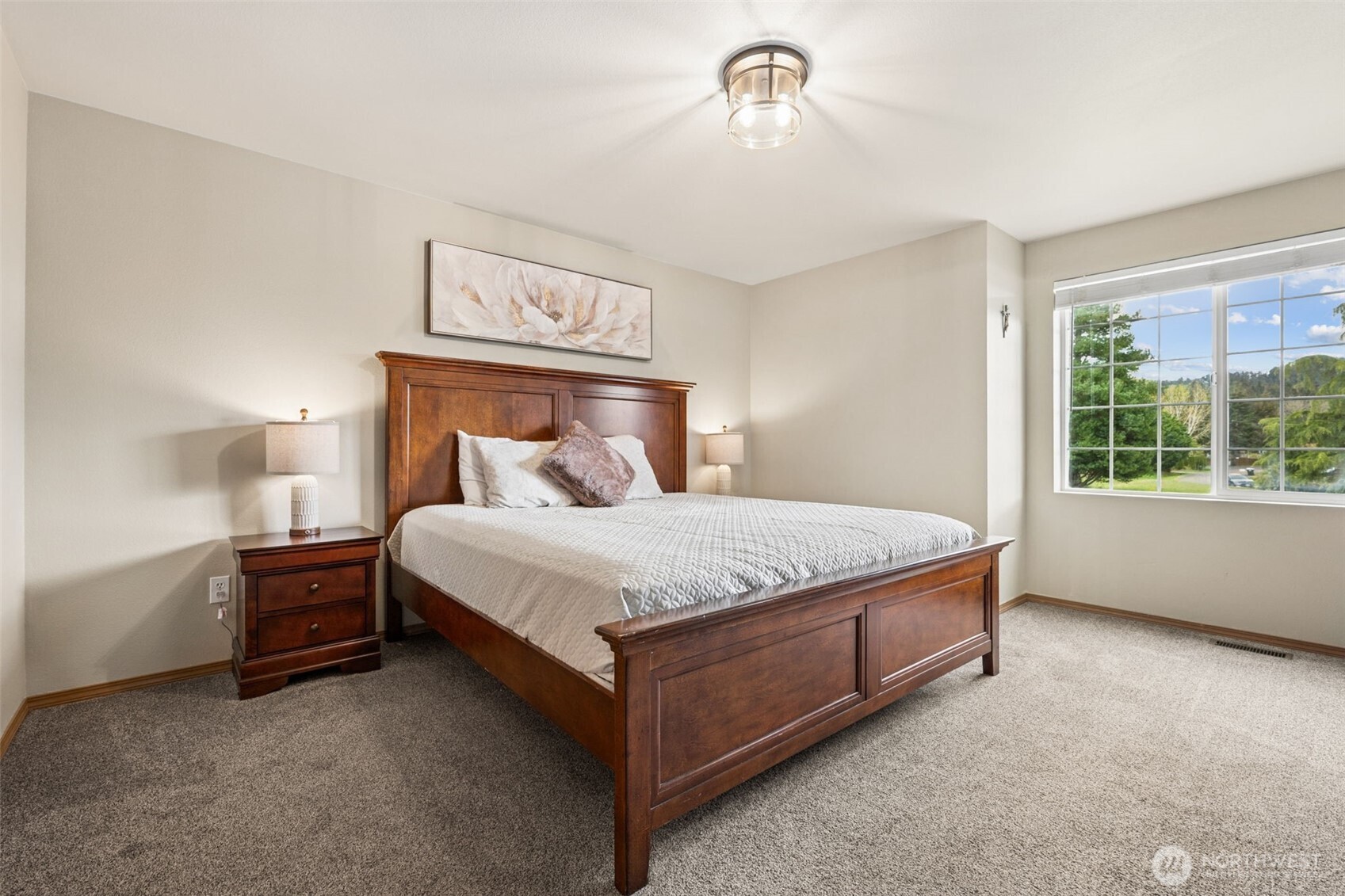 17837 Gilbert Street Southeast Tenino, WA 98589 - Photo 13 of 32 a bed sitting in a room next to a window