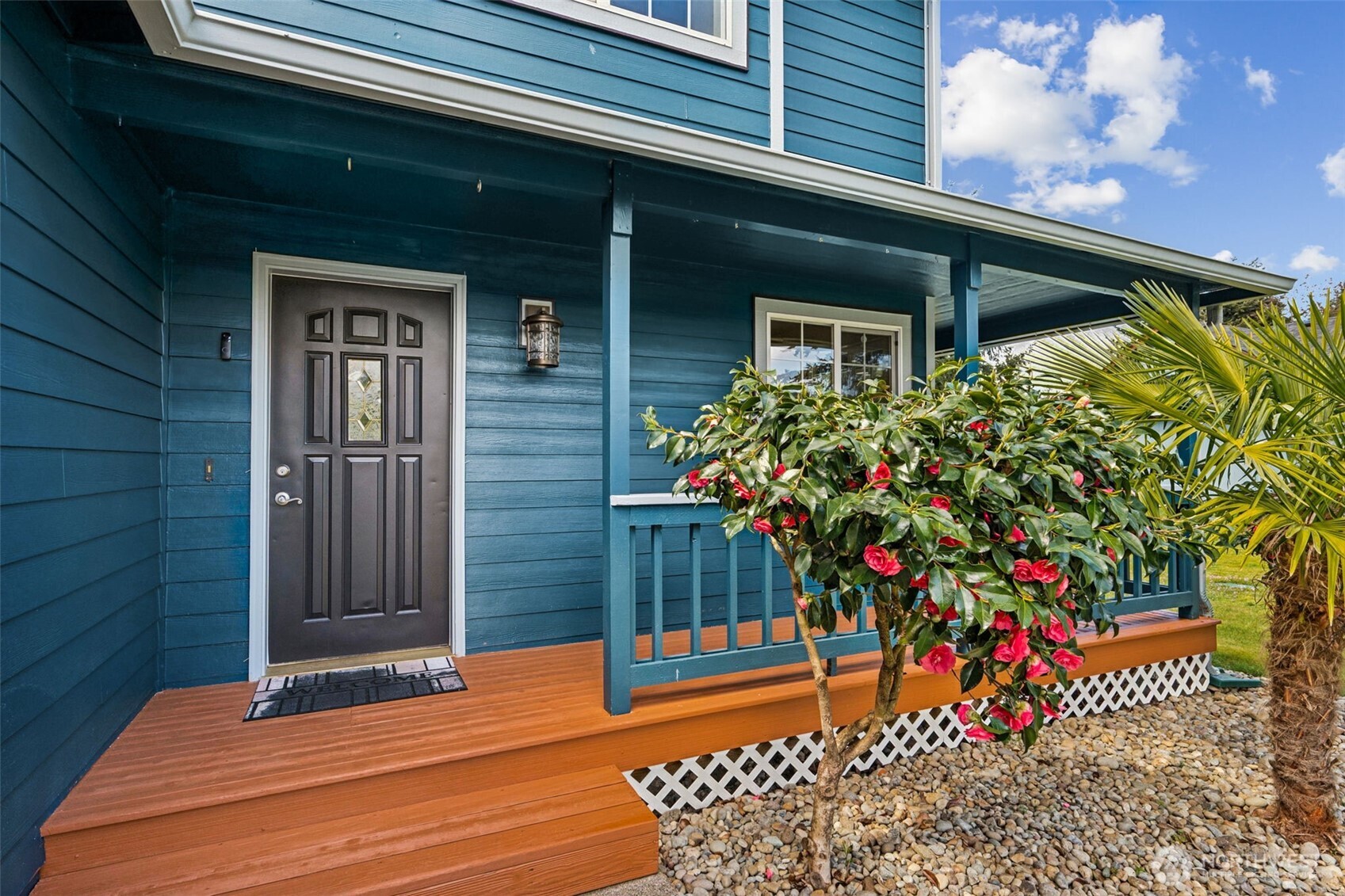 17837 Gilbert Street Southeast Tenino, WA 98589 - Photo 20 of 32 a potted plant sitting in front of a house