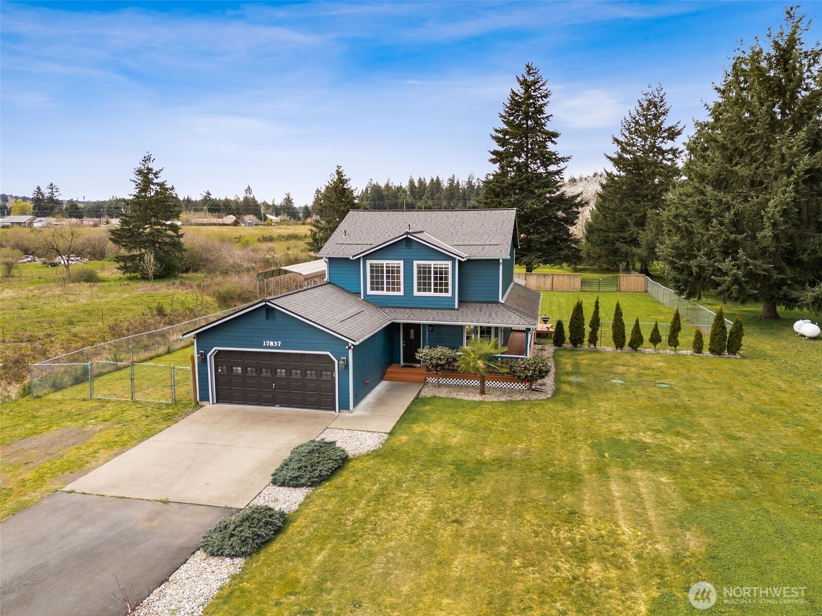 17837 Gilbert Street Southeast Tenino, WA 98589 - Photo 2 of 32 a view of a house with a swimming pool
