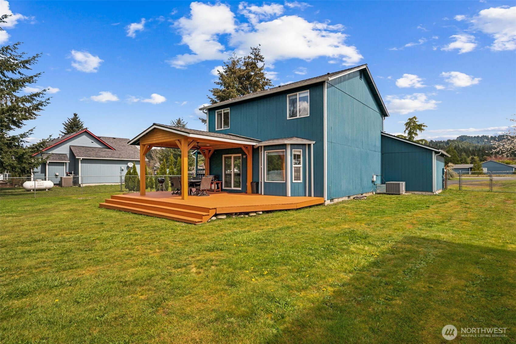 17837 Gilbert Street Southeast Tenino, WA 98589 - Photo 21 of 32 a view of a house with a backyard porch and sitting area