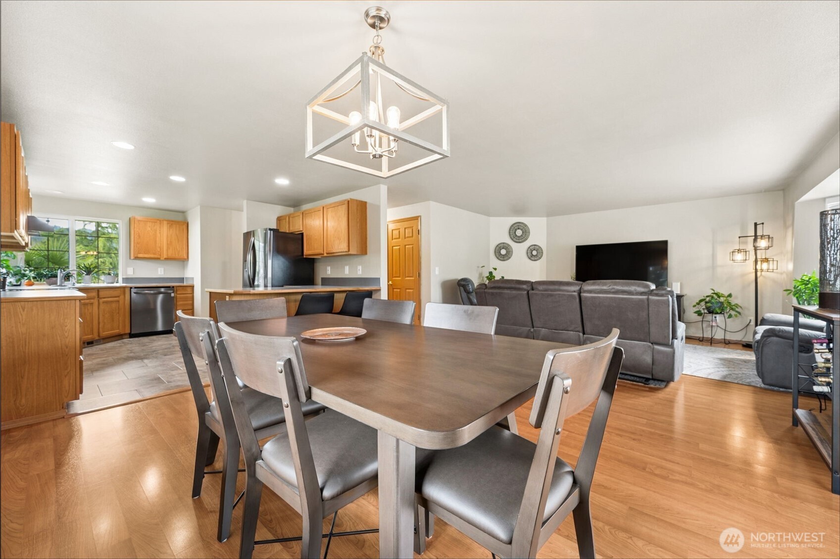 17837 Gilbert Street Southeast Tenino, WA 98589 - Photo 8 of 32 a view of a dining room with furniture wooden floor and chandelier