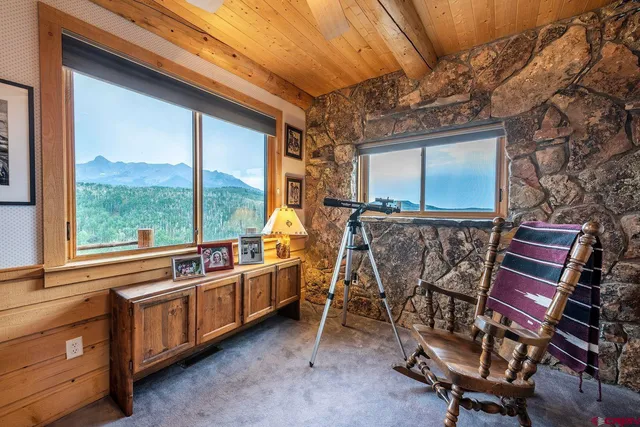 a room with furniture a large window and furniture