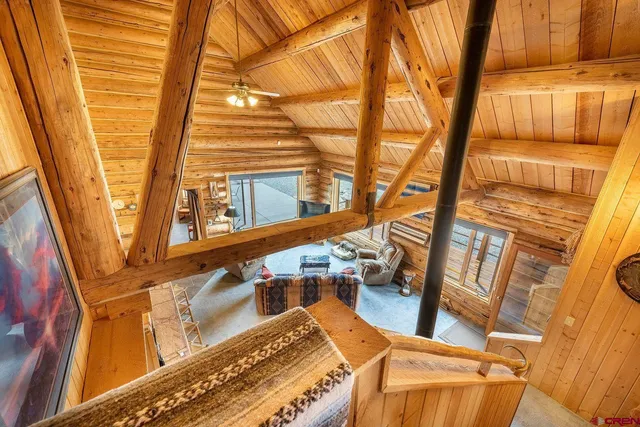 a spacious bathroom with a granite countertop sink and a mirror