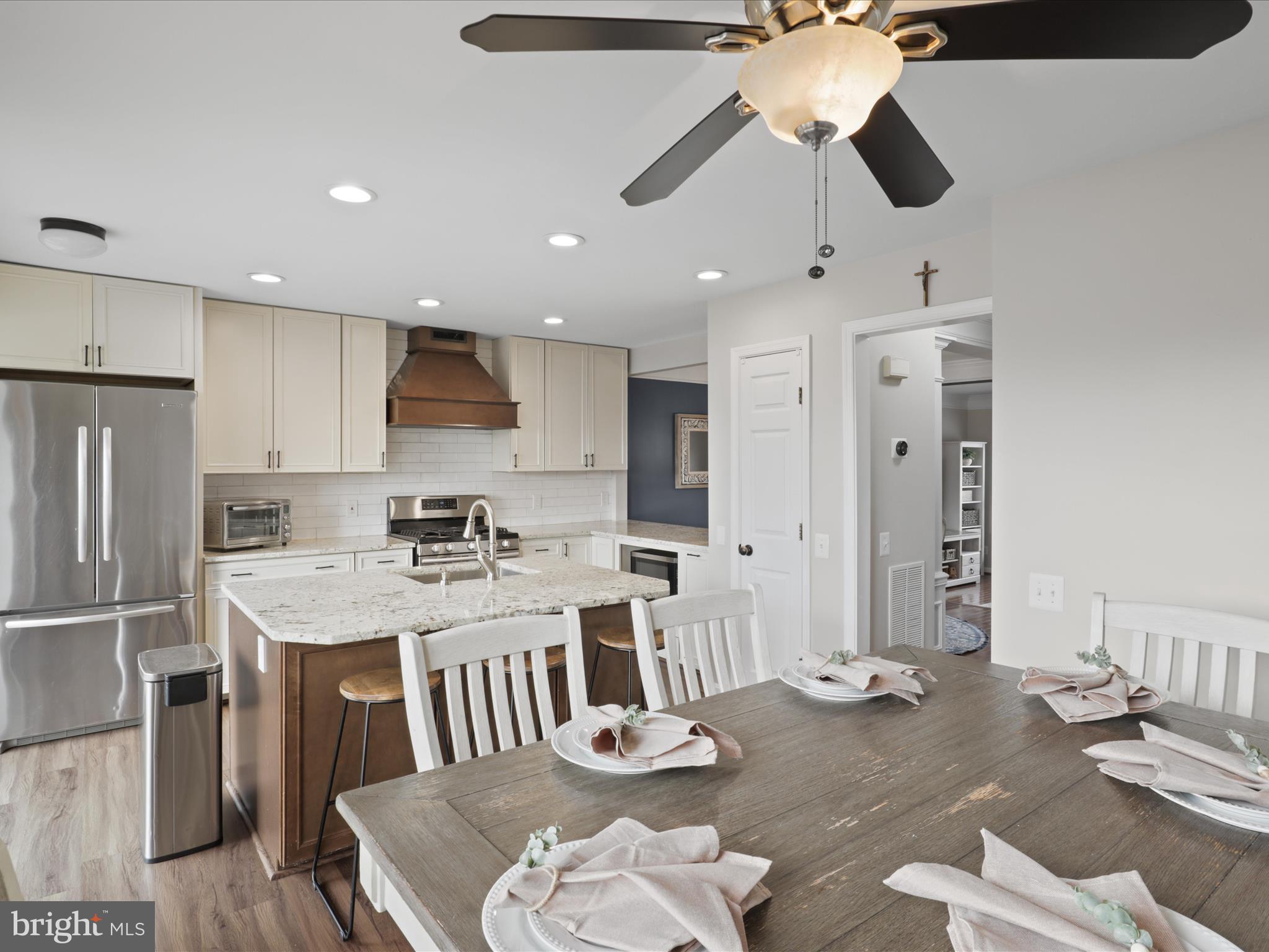 43271 Chokeberry Square Ashburn, VA 20147 - Photo 11 of 45 a large kitchen with a table and chairs