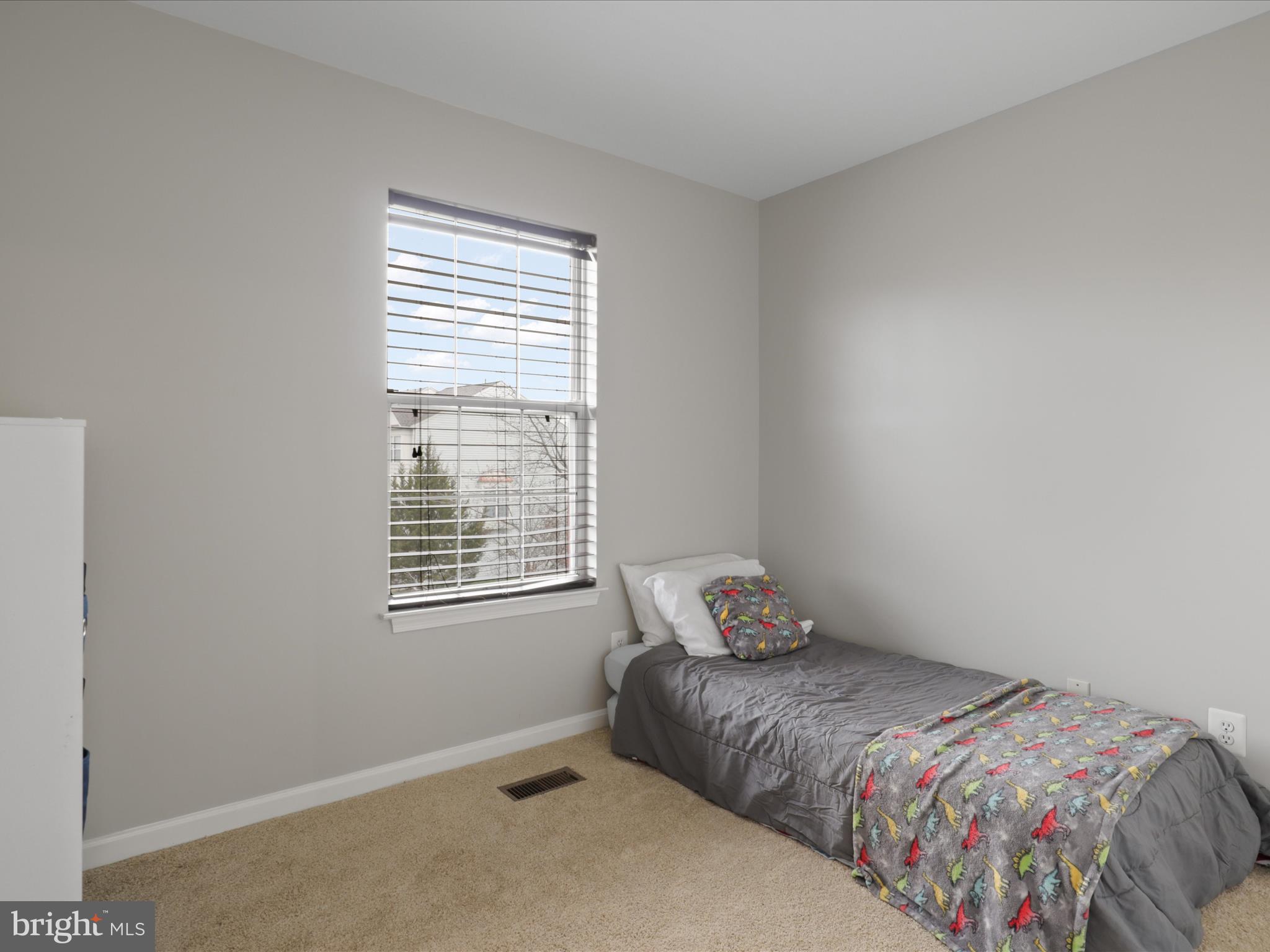 43271 Chokeberry Square Ashburn, VA 20147 - Photo 24 of 45 a bedroom with a bed and window