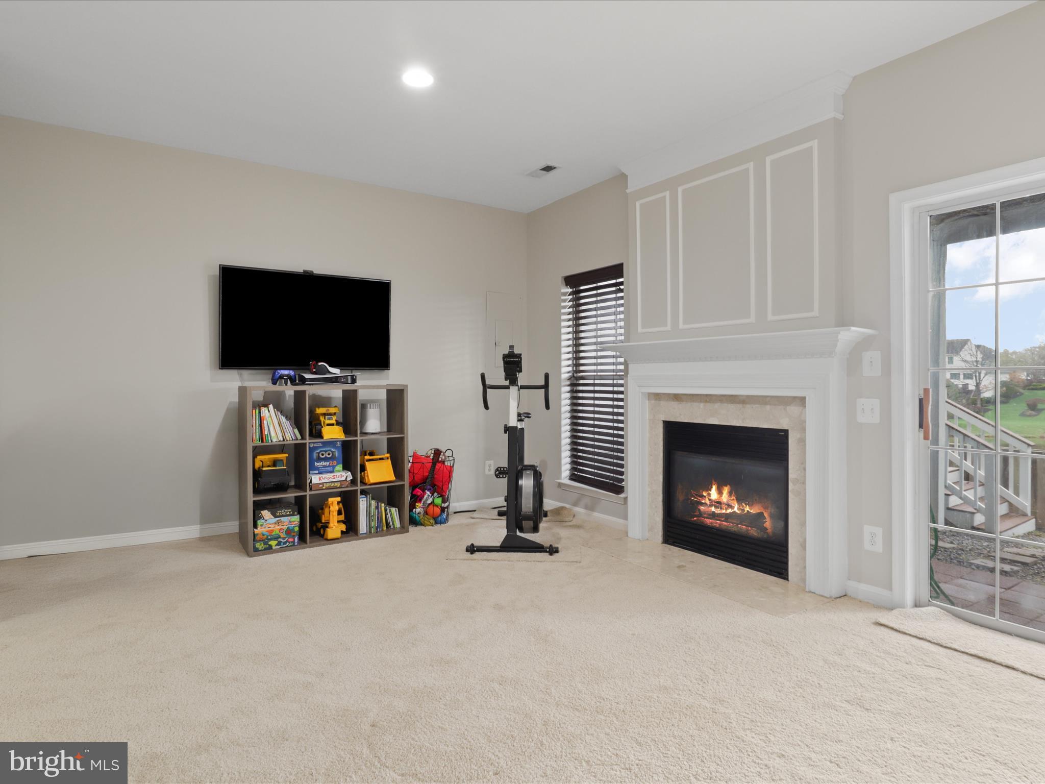 43271 Chokeberry Square Ashburn, VA 20147 - Photo 30 of 45 a living room with furniture and a fireplace