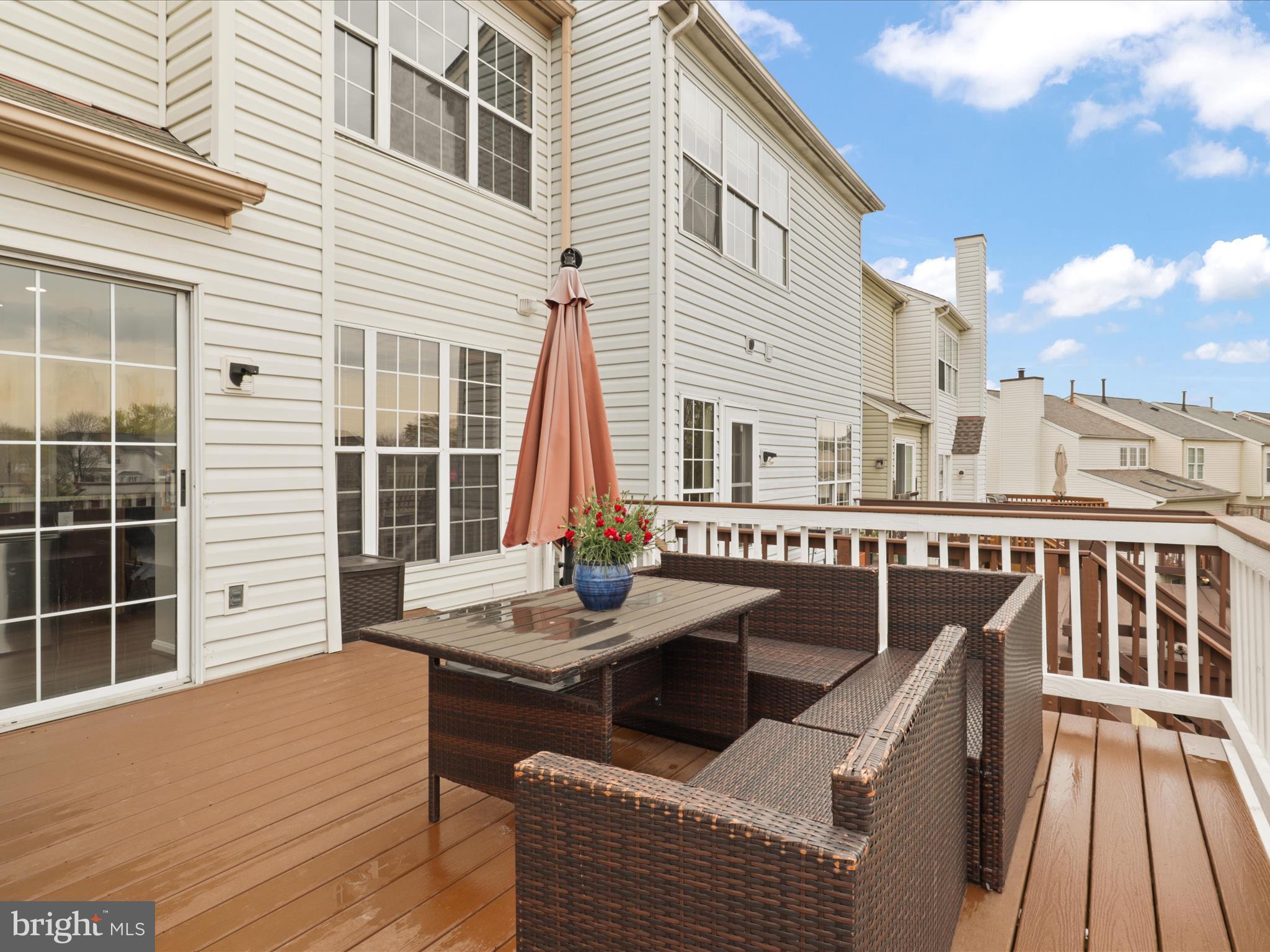 43271 Chokeberry Square Ashburn, VA 20147 - Photo 31 of 45 a balcony with table and chairs