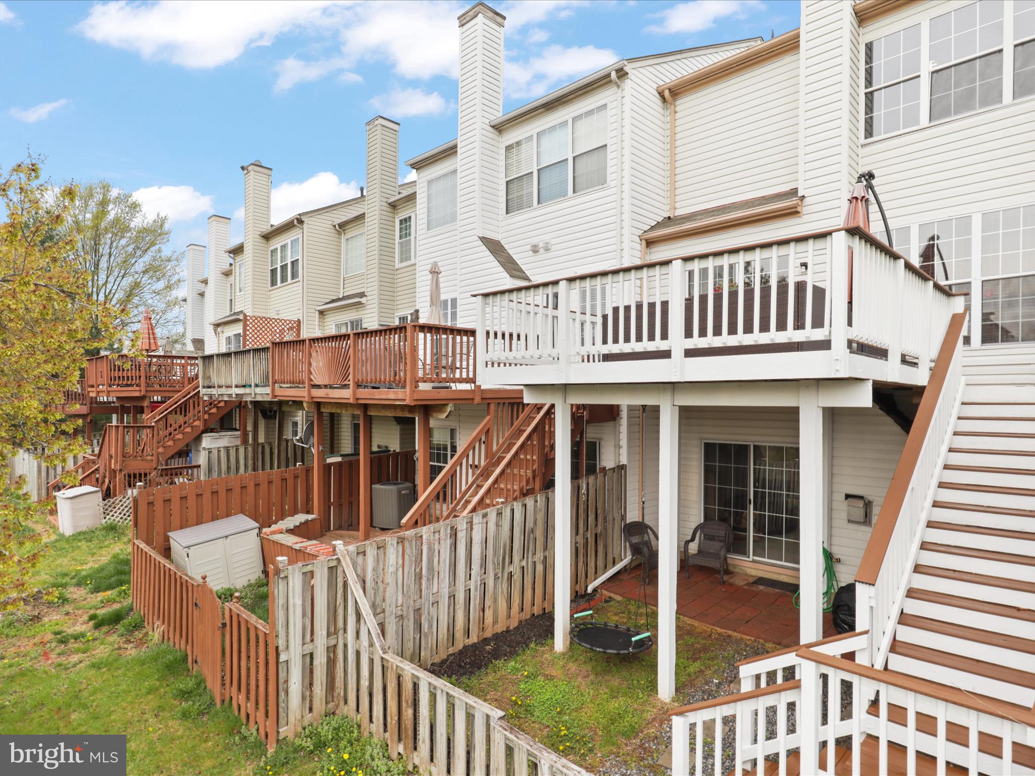 43271 Chokeberry Square Ashburn, VA 20147 - Photo 35 of 45 a view of a house with wooden deck