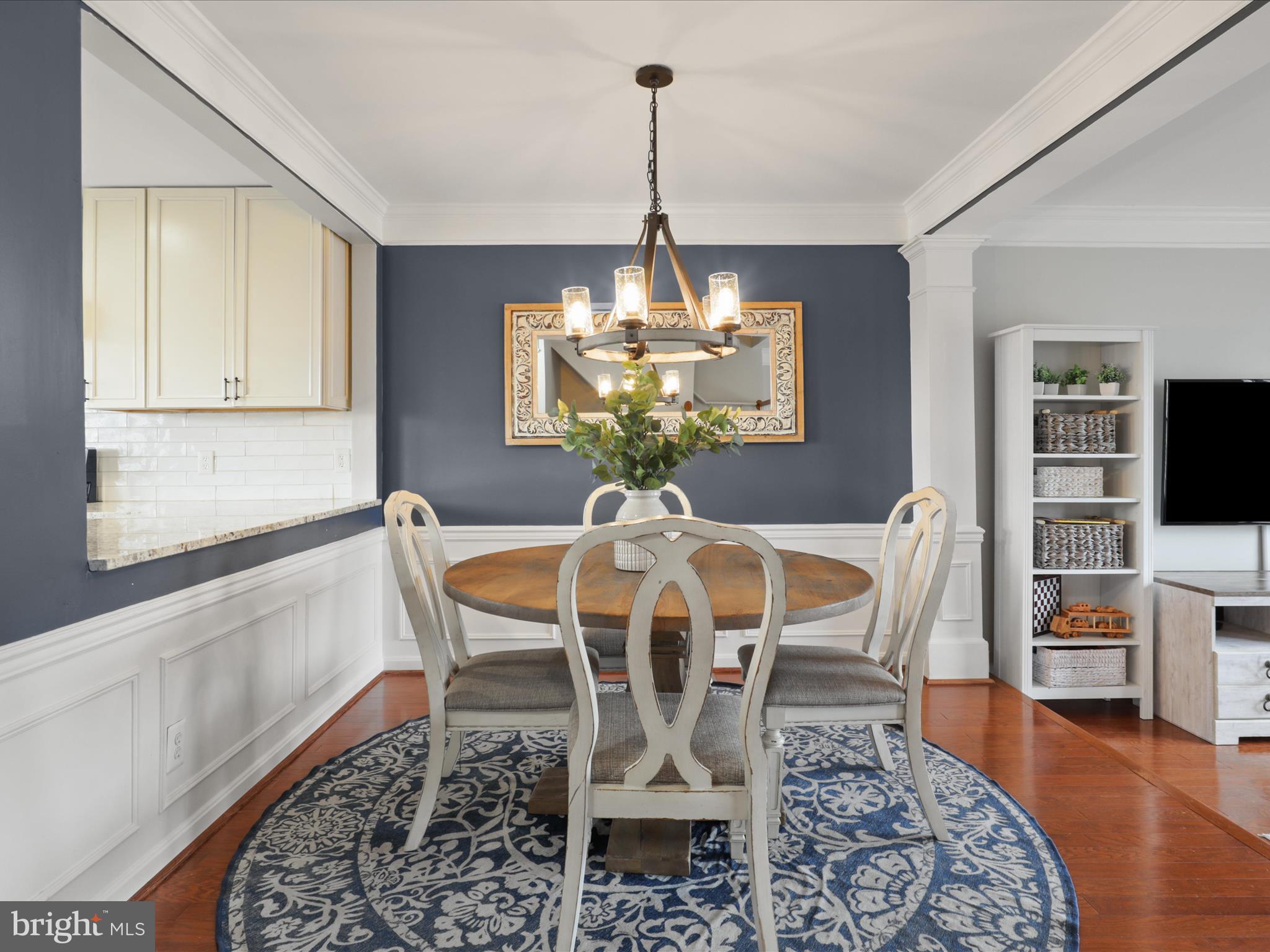 43271 Chokeberry Square Ashburn, VA 20147 - Photo 5 of 45 a dining room with furniture a chandelier and wooden floor