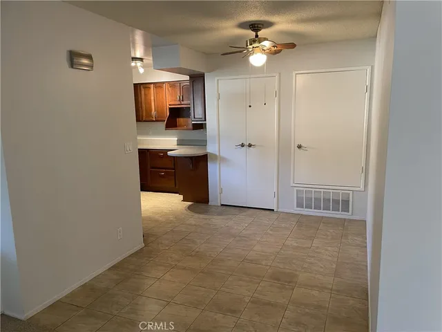 a kitchen with granite countertop a stove and a microwave