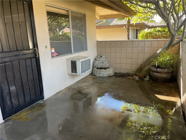 a kitchen with a refrigerator and window