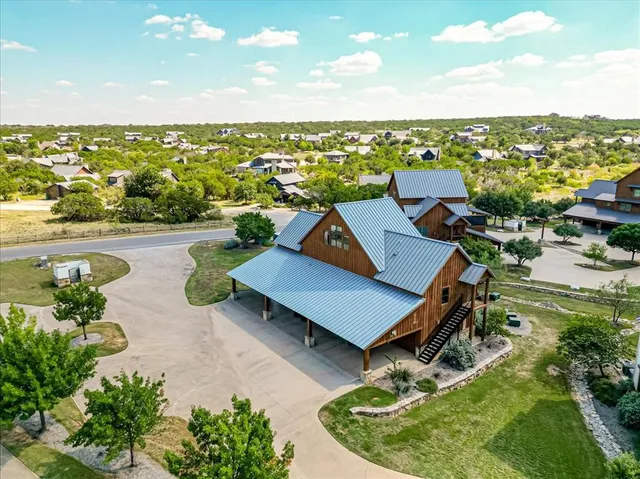an aerial view of a house with swimming pool