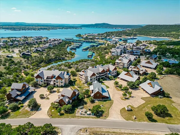 an aerial view of residential houses with outdoor space