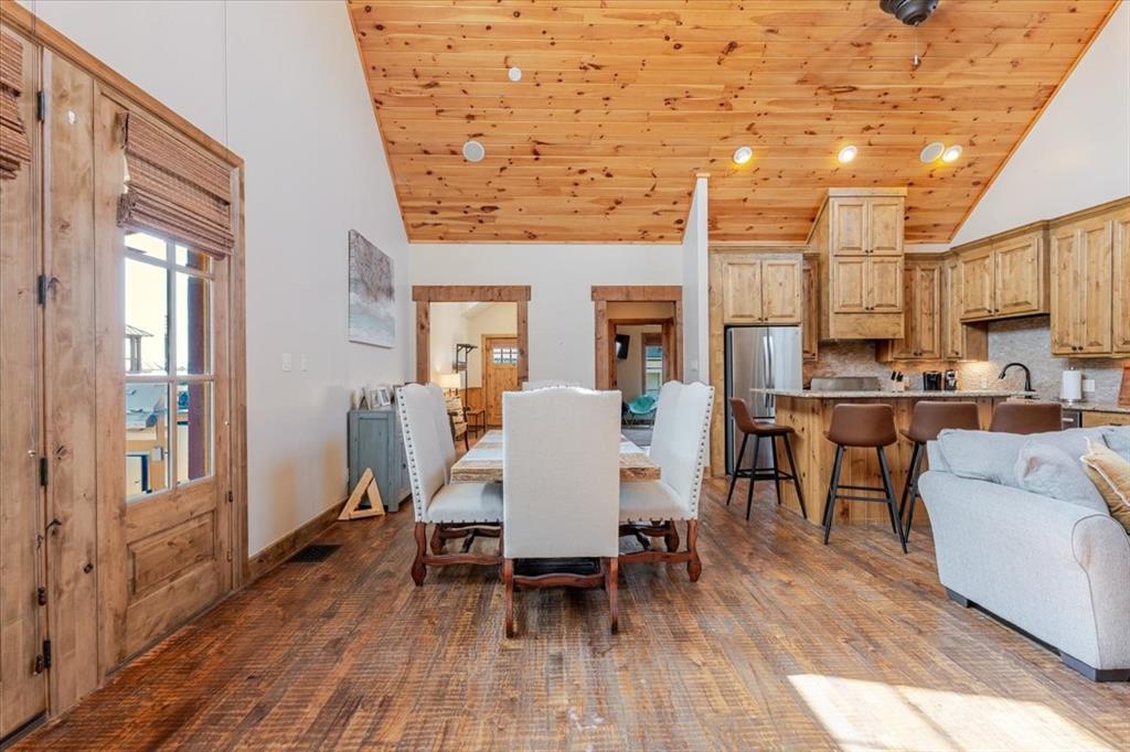 2034 Harbor Way, Unit 601 Graford, TX 76449 - Photo 11 of 27 a view of a dining room with furniture and wooden floor