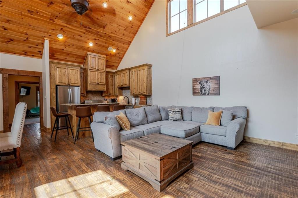 2034 Harbor Way, Unit 601 Graford, TX 76449 - Photo 15 of 27 a living room with furniture and a view of kitchen