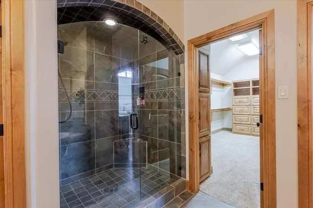 a bedroom with a bed chair and a window