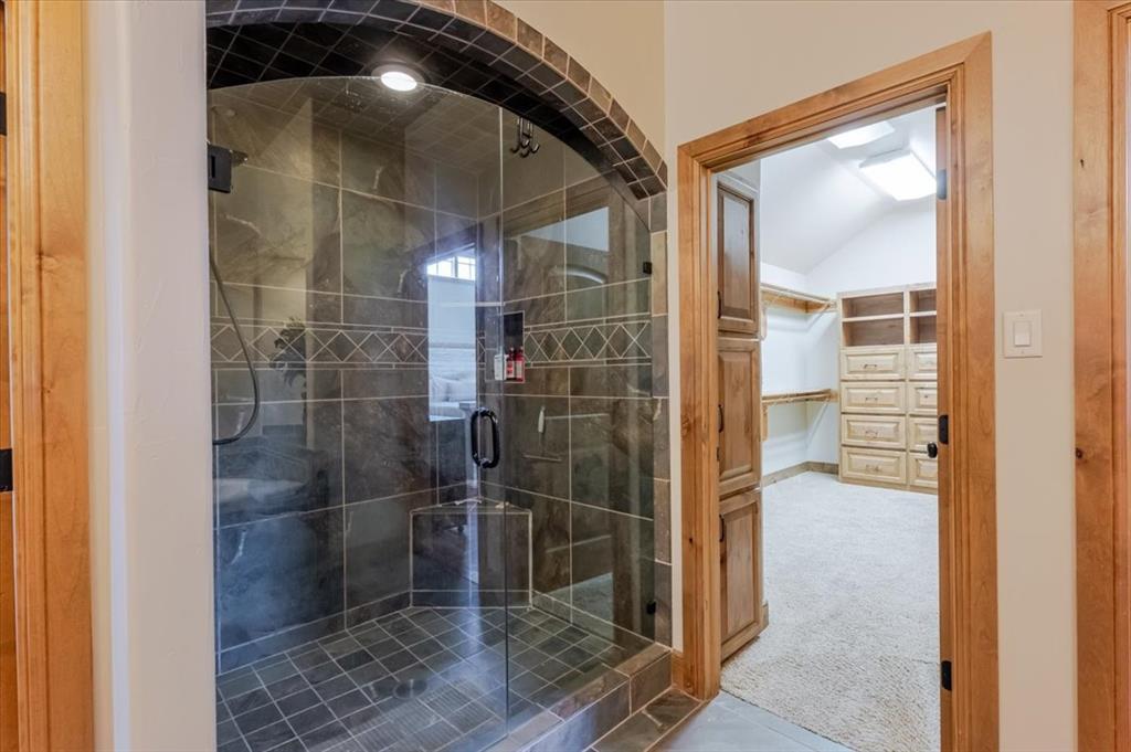 2034 Harbor Way, Unit 601 Graford, TX 76449 - Photo 18 of 27 a bathroom with a shower and a sink