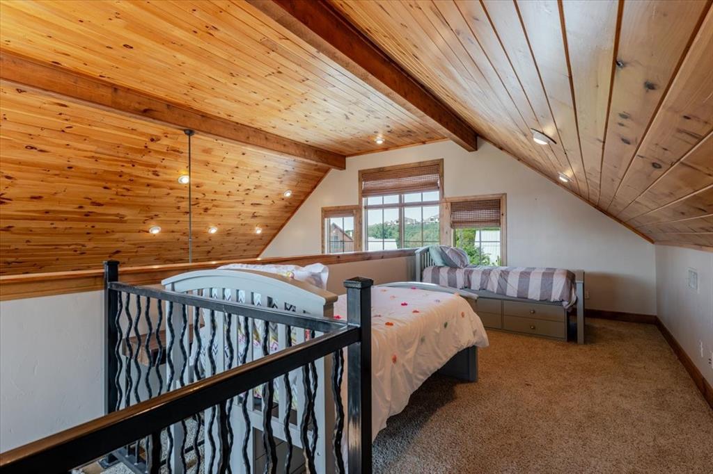 2034 Harbor Way, Unit 601 Graford, TX 76449 - Photo 21 of 27 a bed room with furniture and windows