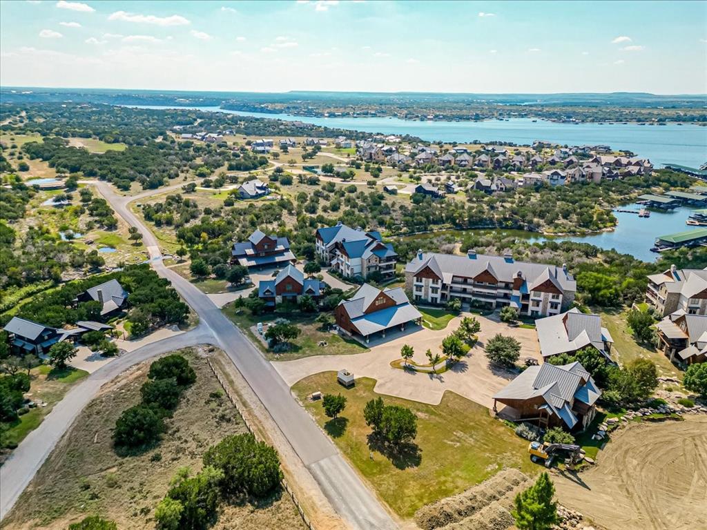 2034 Harbor Way, Unit 601 Graford, TX 76449 - Photo 27 of 27 an aerial view of residential houses with outdoor space