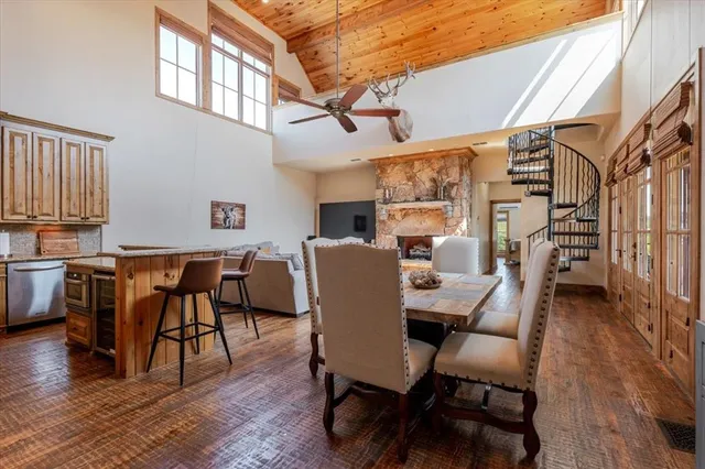 a view of a workspace with furniture and wooden floor