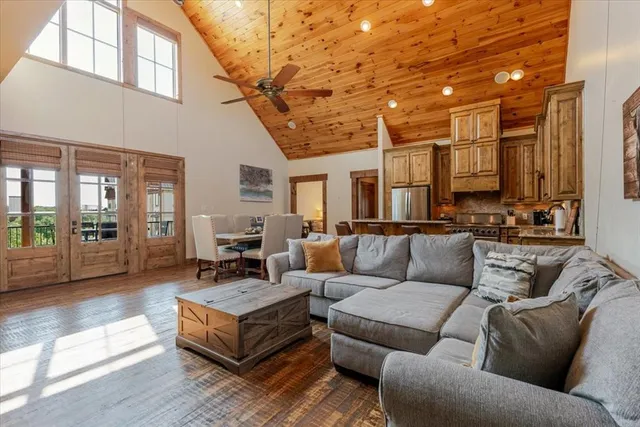a kitchen with stainless steel appliances granite countertop a sink and a refrigerator
