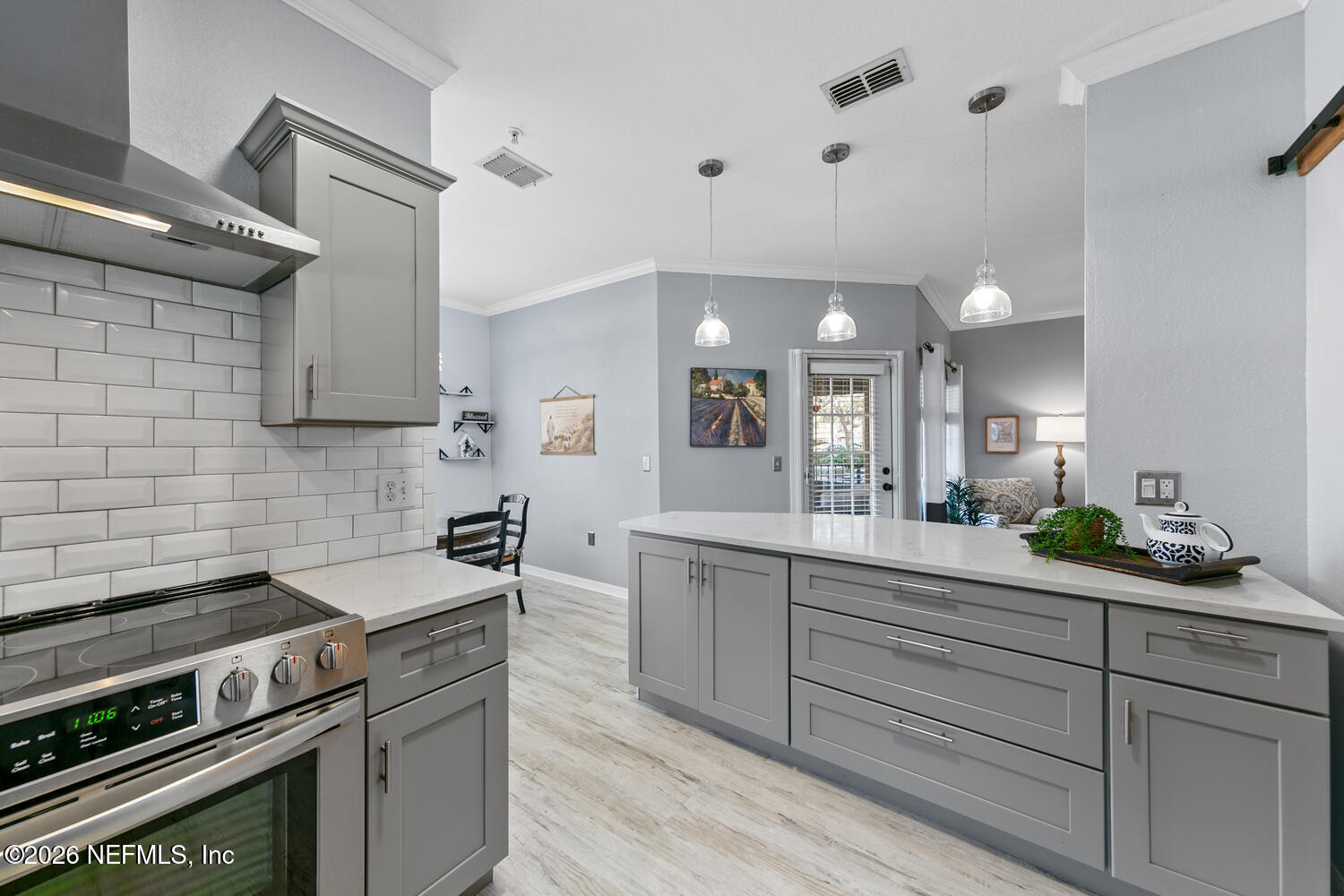 10961 Burnt Mill Road, Unit 317 Jacksonville, FL 32256 - Photo 12 of 39 a kitchen with a sink and cabinets