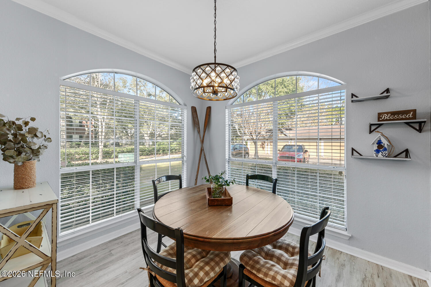 10961 Burnt Mill Road, Unit 317 Jacksonville, FL 32256 - Photo 13 of 39 a view of a dining room with furniture window and wooden floor
