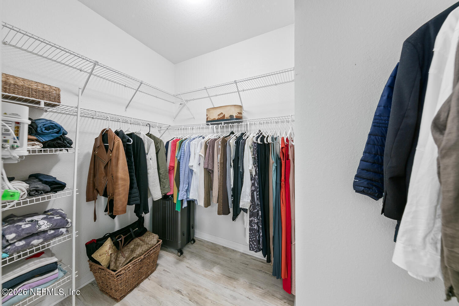 10961 Burnt Mill Road, Unit 317 Jacksonville, FL 32256 - Photo 19 of 39 a view of walk in closet with clothes