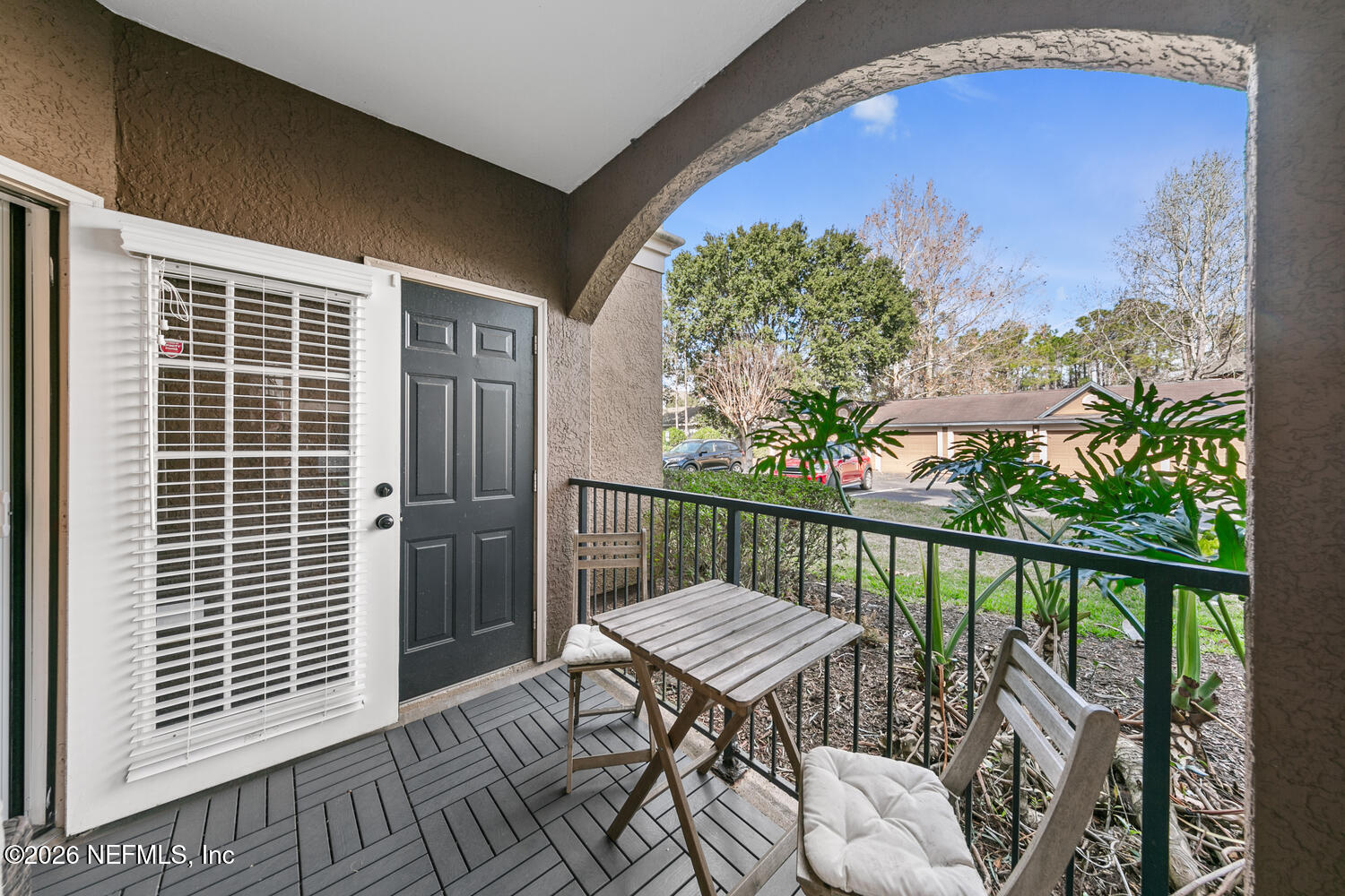 10961 Burnt Mill Road, Unit 317 Jacksonville, FL 32256 - Photo 23 of 39 a view of a balcony with furniture