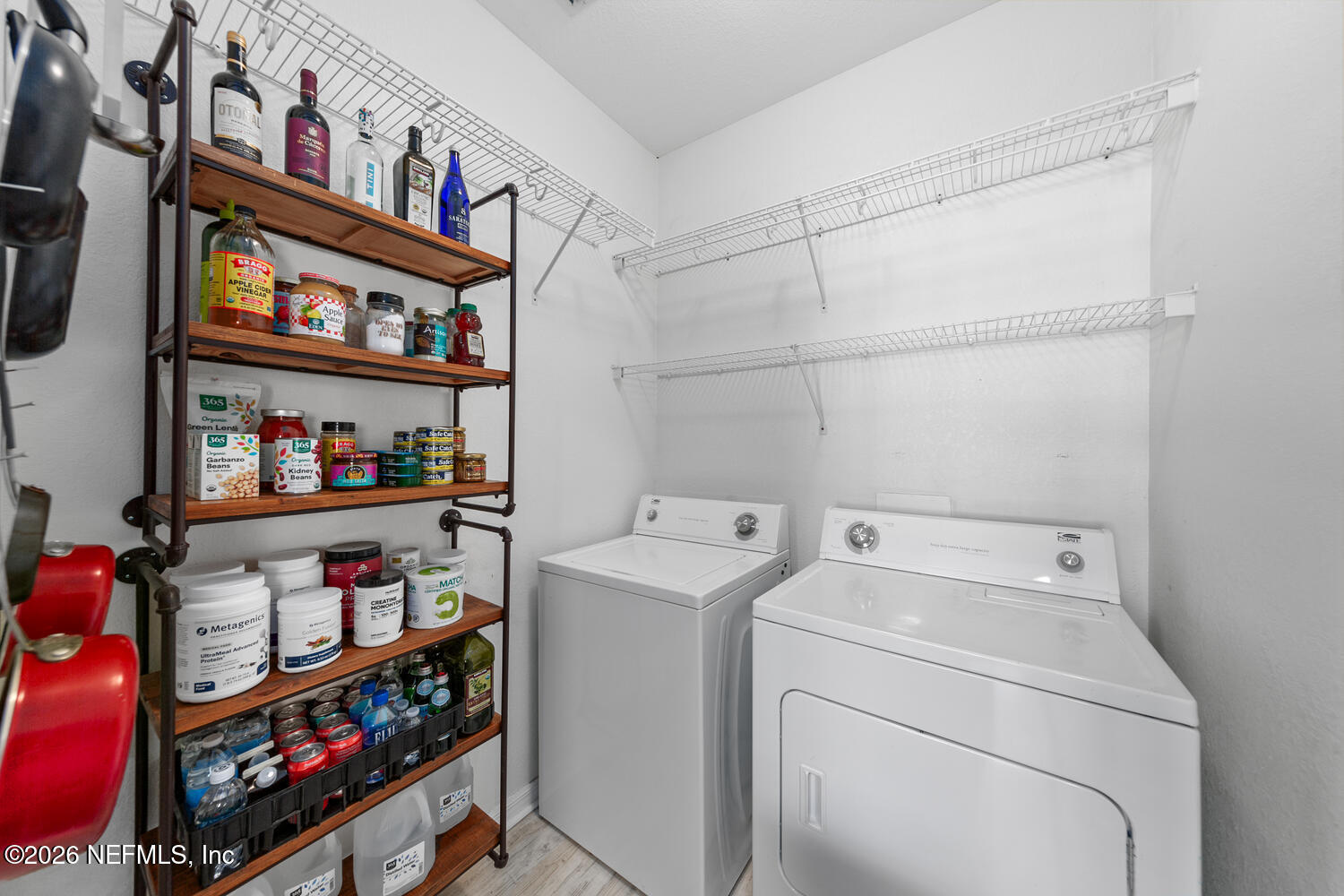 10961 Burnt Mill Road, Unit 317 Jacksonville, FL 32256 - Photo 24 of 39 a utility room with dryer and washer