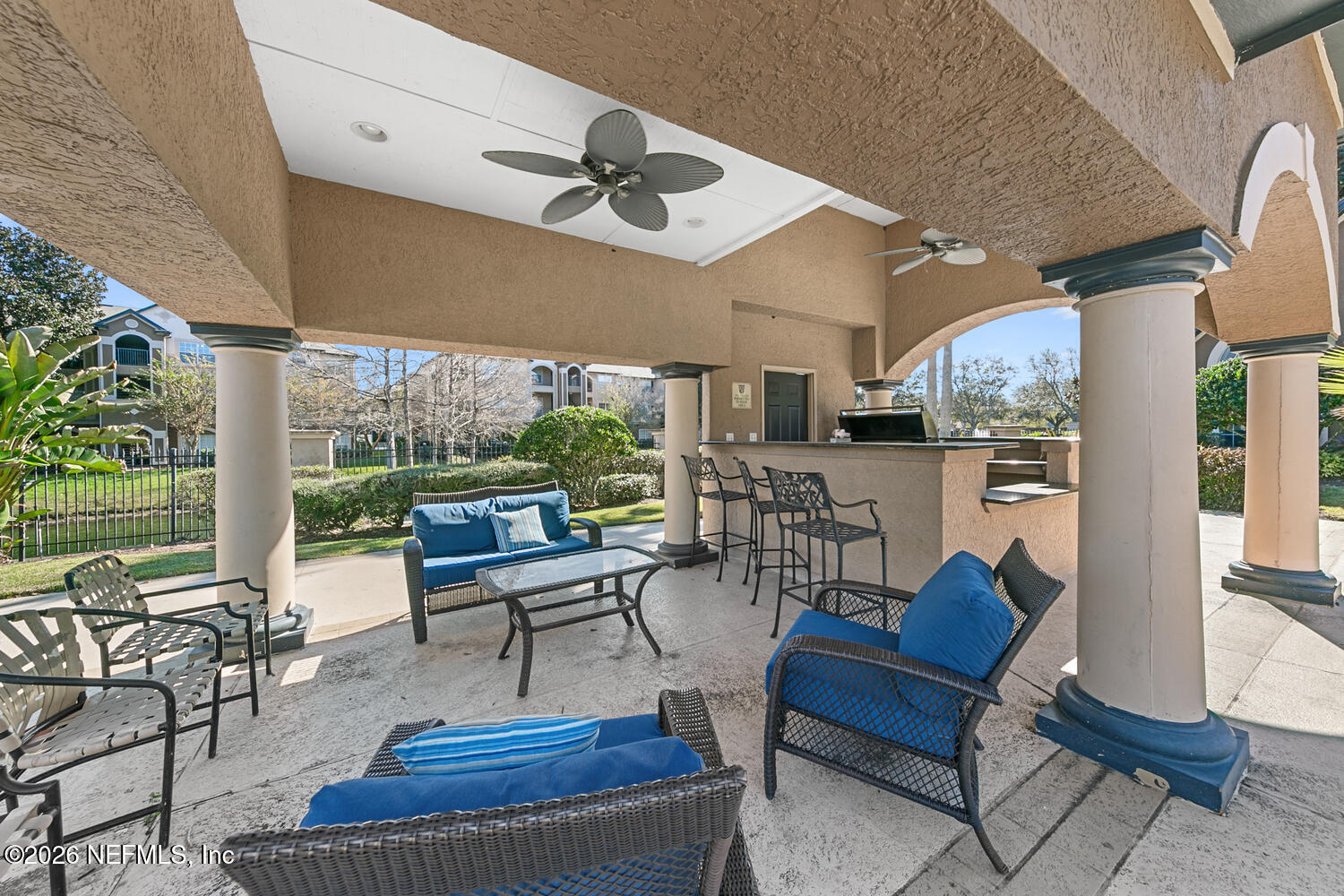 10961 Burnt Mill Road, Unit 317 Jacksonville, FL 32256 - Photo 27 of 39 a living room with fireplace furniture and a large window