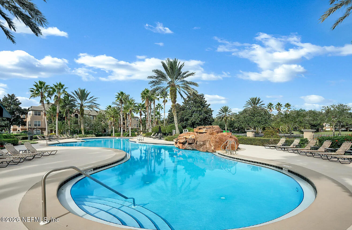10961 Burnt Mill Road, Unit 317 Jacksonville, FL 32256 - Photo 28 of 39 a view of a swimming pool with a yard