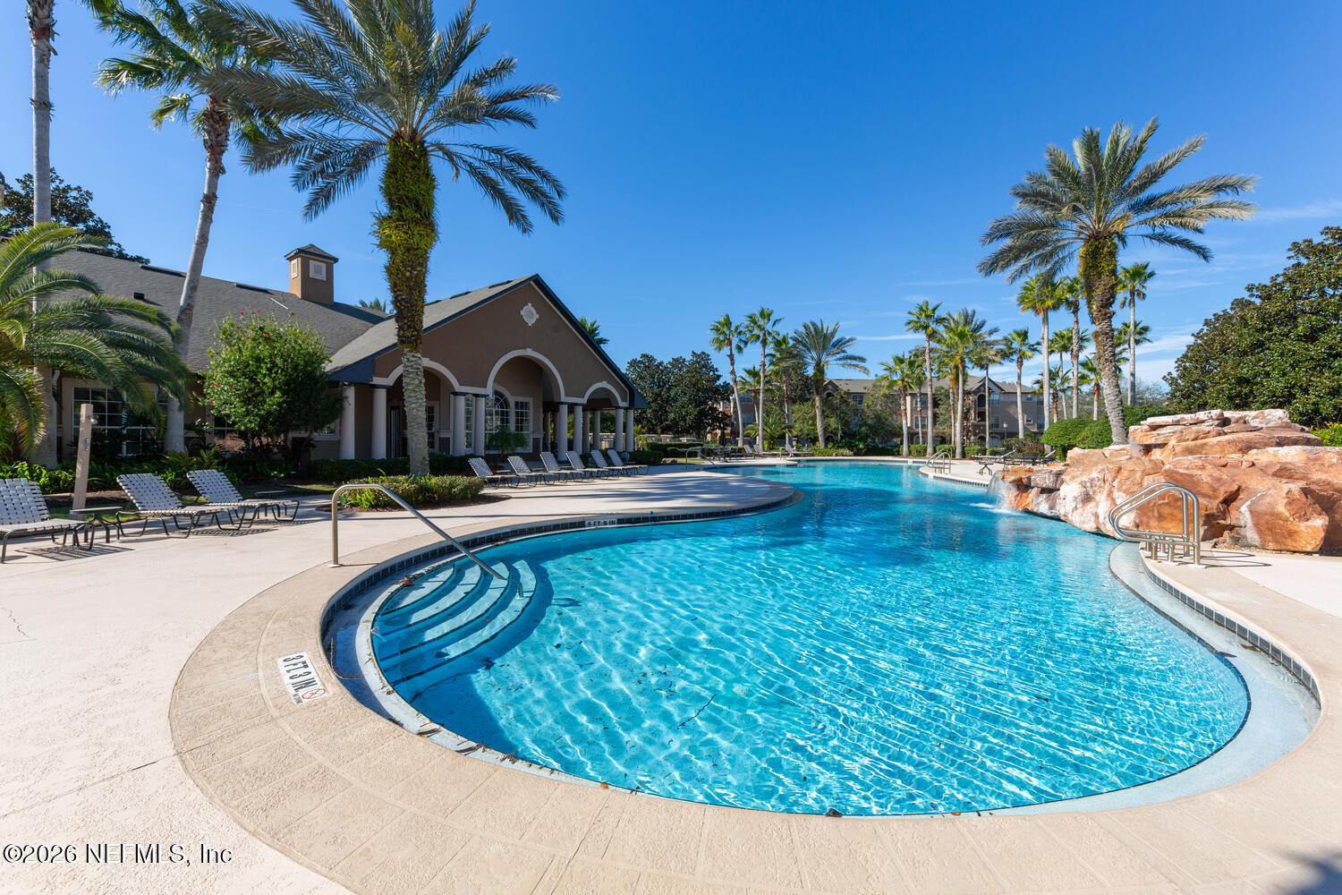 10961 Burnt Mill Road, Unit 317 Jacksonville, FL 32256 - Photo 32 of 39 a view of swimming pool with a garden