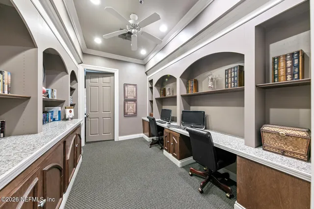 a view of a house with a big yard and large trees