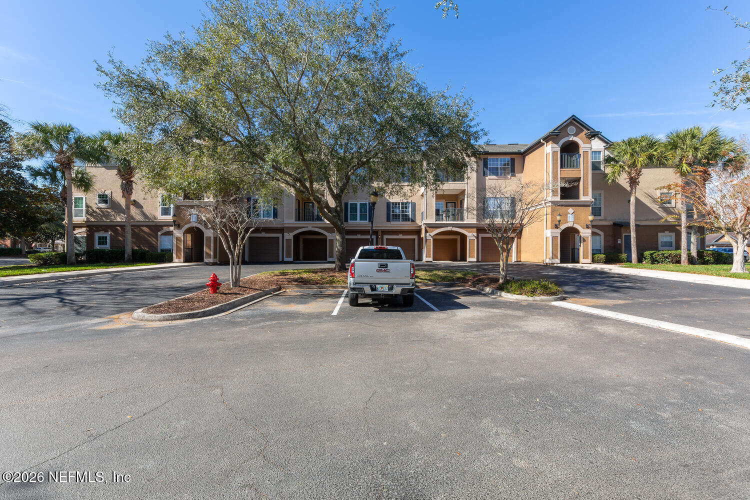 10961 Burnt Mill Road, Unit 317 Jacksonville, FL 32256 - Photo 37 of 39 a view of a street with houses