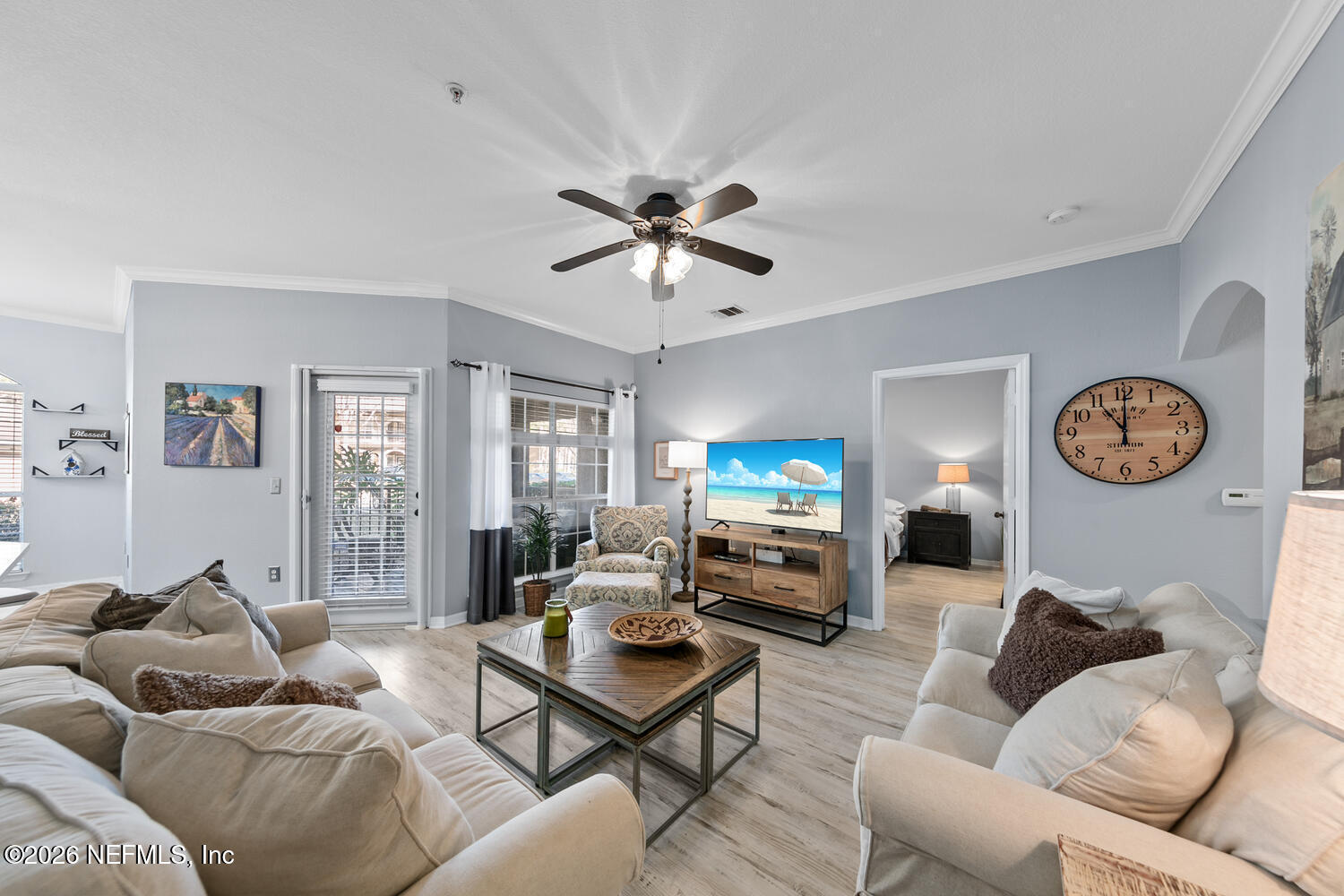 10961 Burnt Mill Road, Unit 317 Jacksonville, FL 32256 - Photo 6 of 39 a living room with furniture a couch and a window