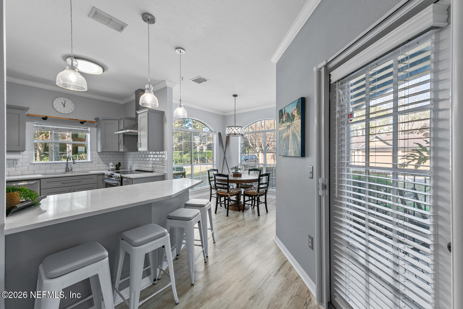 10961 Burnt Mill Road, Unit 317 Jacksonville, FL 32256 - Photo 8 of 39 a large kitchen with a table and chairs