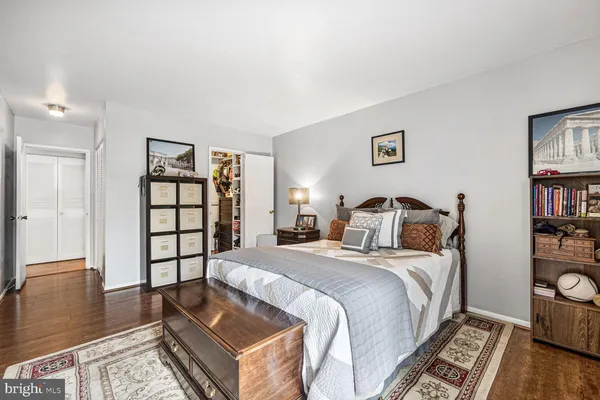 a bed room with a bed and a book shelf