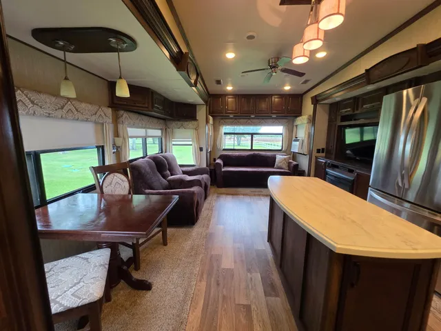 a lobby with furniture and a flat screen tv