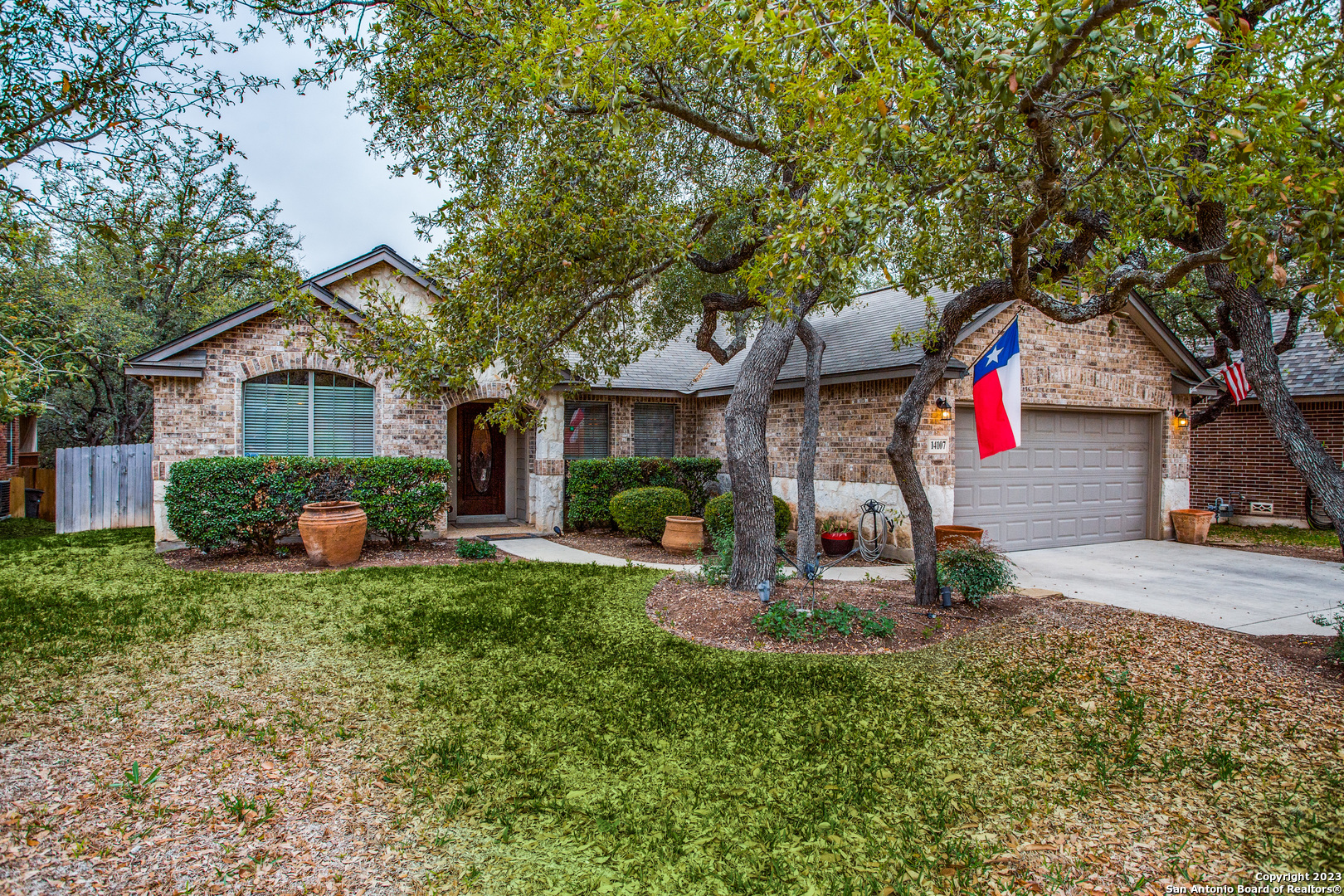 a front view of a house with swing and table and chairs