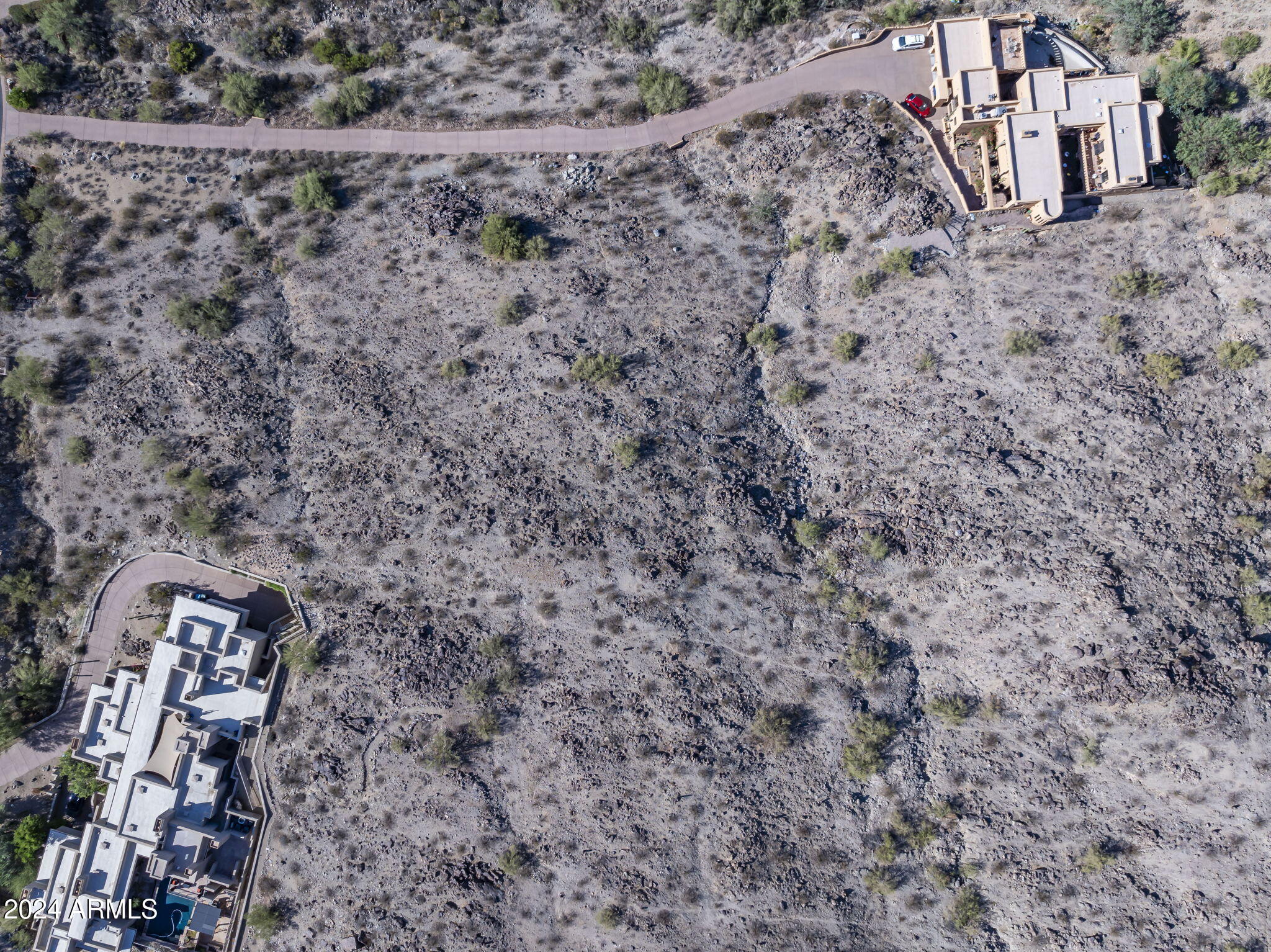 14008 South Rockhill Road, Unit 40 Phoenix, AZ 85048 - Photo 12 of 31 a view of a dry yard with wooden fence