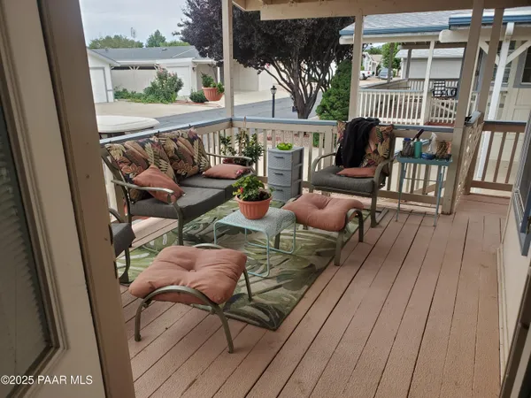 a view of balcony with furniture